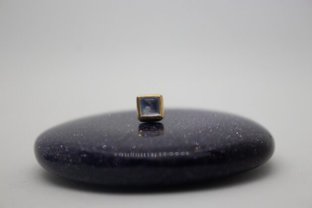 Gold piercing jewelry by NAGA jewelry organics. square shaped featuring a moonstone
