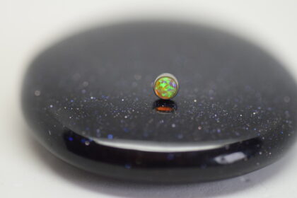 piercing jewelry by Divinity metals. a bezel setting from implant grade titanium features a synthetic yellow opal cabochon
